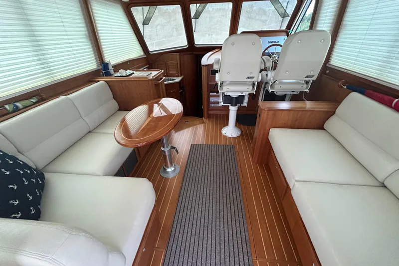 Slide: The Image of Interior of 2015 Sabre 42 Salon Express with elegant seating and wooden finishes. - 35