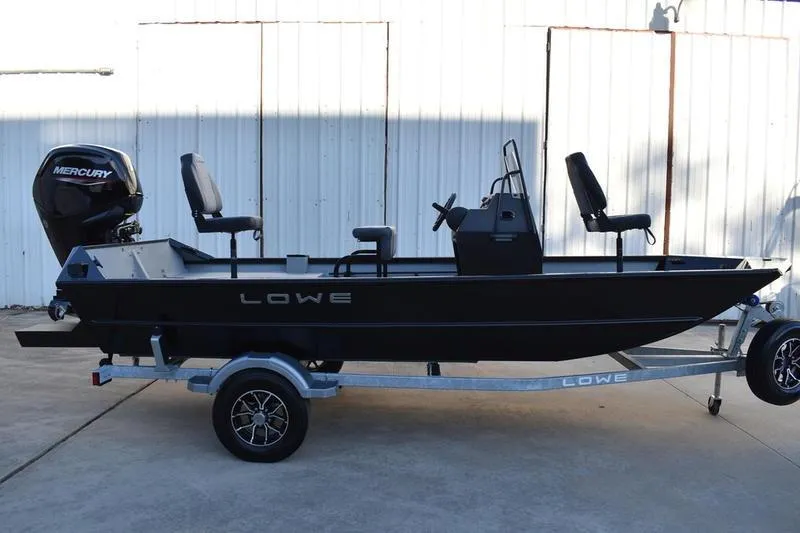 The Image of 2026 Lowe Roughneck RX1760 Pathfinder boat on trailer, featuring Mercury outboard motor. - 0