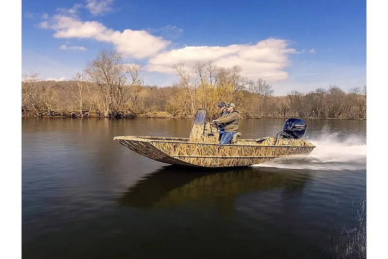 Slide: The Image of 2026 Lowe Roughneck RX1760 Pathfinder boat on trailer, featuring Mercury outboard motor. - 1