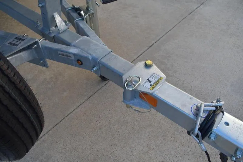 Slide: The Image of 2026 Lowe Roughneck RX1760 Pathfinder boat storage compartments open on deck. - 12