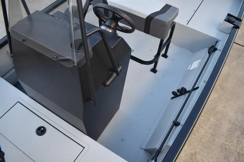 Slide: The Image of Open storage compartment on 2026 Lowe Roughneck RX1760 Pathfinder boat. - 13