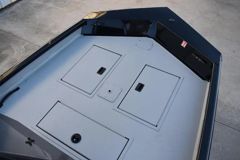 Slide: The Image of 2026 Lowe Roughneck RX1760 Pathfinder boat deck with storage compartments. - 9