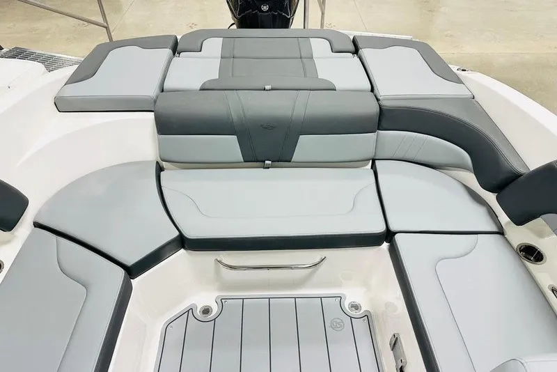 Slide: The Image of 2025 Chaparral 23 SSi OB boat interior with gray cushioned seating. - 11