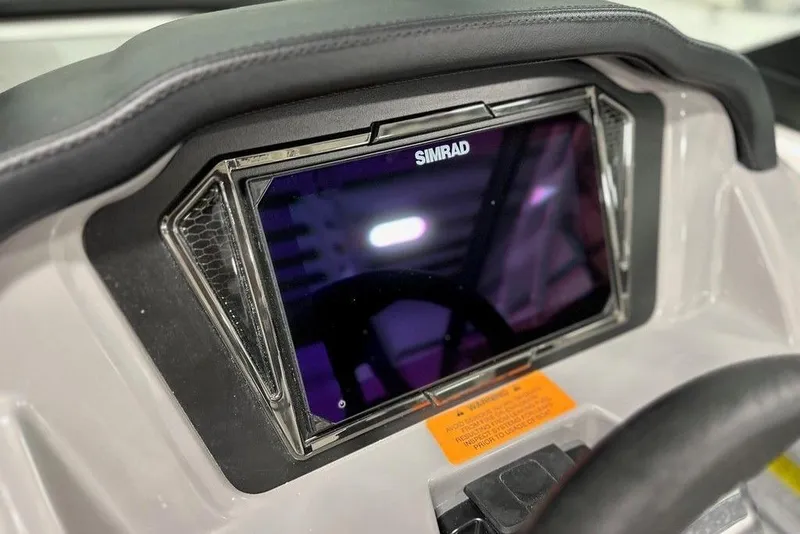 Slide: The Image of Simrad display on 2025 Chaparral 23 SSi OB boat dashboard. - 2