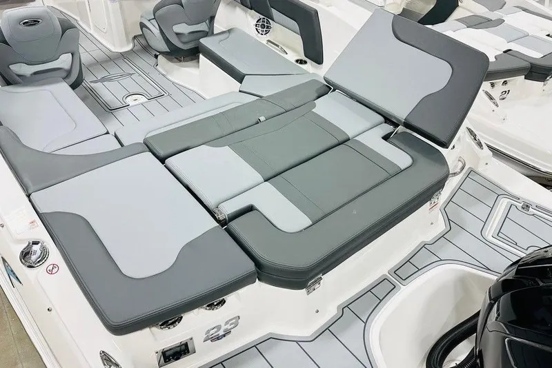 Slide: The Image of 2025 Chaparral 23 SSi OB boat interior with gray seating and modern design. - 6