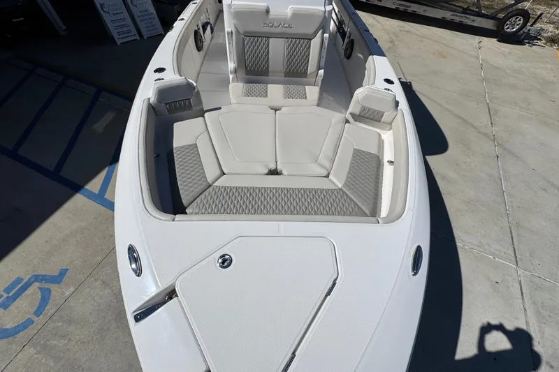Slide: The Image of 2025 Solace 28 HCS boat with luxurious seating and modern design. - 19