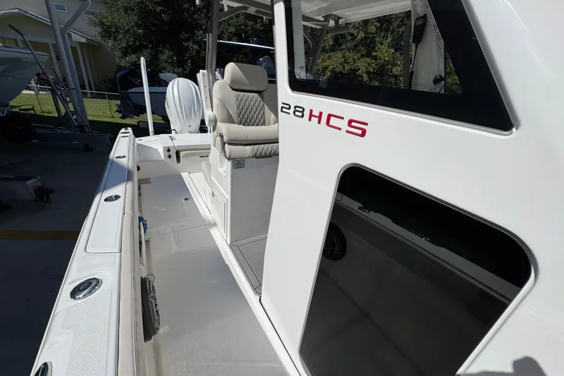 Slide: The Image of 2025 Solace 28 HCS boat with sleek design and comfortable seating. - 23