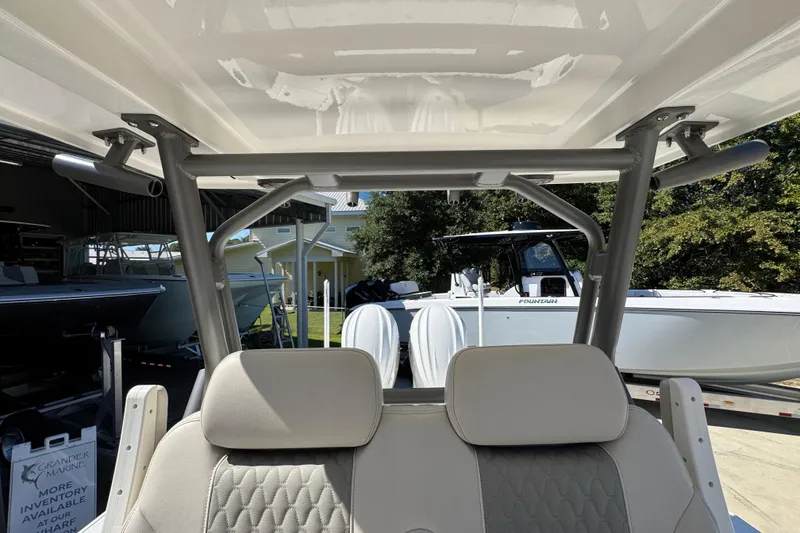 Slide: The Image of 2025 Solace 28 HCS boat interior with seating and T-top structure. - 28