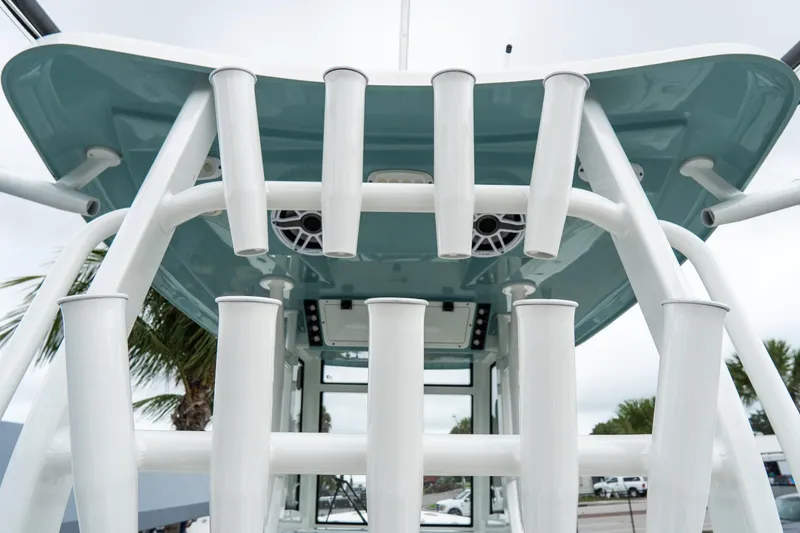 Slide: The Image of Tidewater 292 CC Adventure 2022 boat with rod holders and speakers, viewed from below. - 12