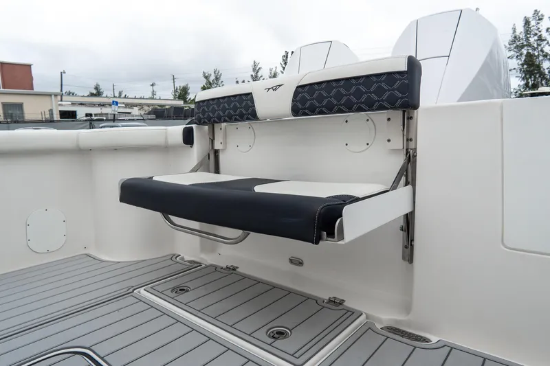 Slide: The Image of 2022 Tidewater 292 CC Adventure boat with foldable seating and sleek deck design. - 15