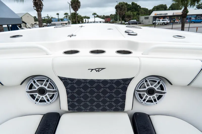 Slide: The Image of 2022 Tidewater 292 CC Adventure boat interior with speakers and cup holders. - 31