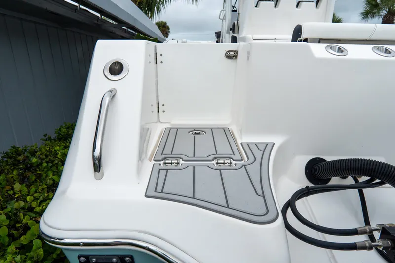 Slide: The Image of 2022 Tidewater 292 CC Adventure boat deck with sleek design and modern fittings. - 7