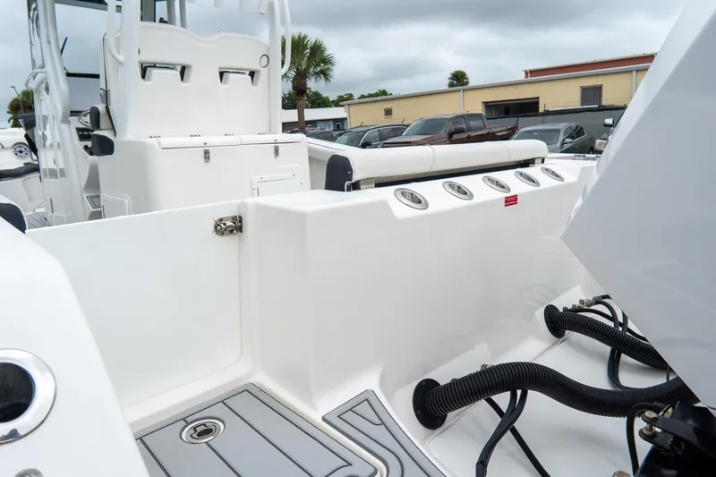 Slide: The Image of 2022 Tidewater 292 CC Adventure boat interior with seating and storage compartments. - 8