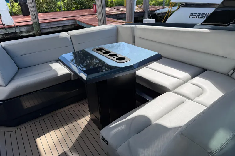 Slide: The Image of Luxurious seating area on 2022 Vanquish VQ45 yacht with sleek table design. - 20
