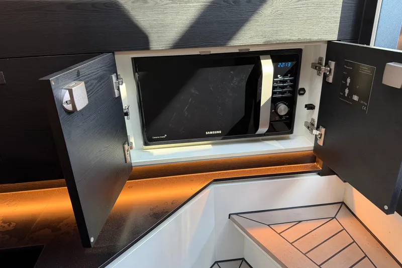 Slide: The Image of Modern kitchen in 2022 Vanquish VQ45 yacht with built-in Samsung microwave. - 22