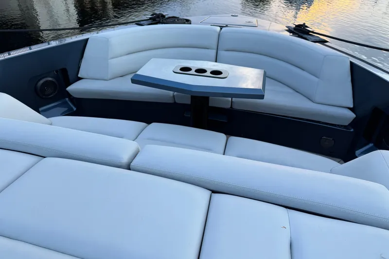 Slide: The Image of Luxurious seating area on 2022 Vanquish VQ45 yacht with sleek design and cup holders. - 28
