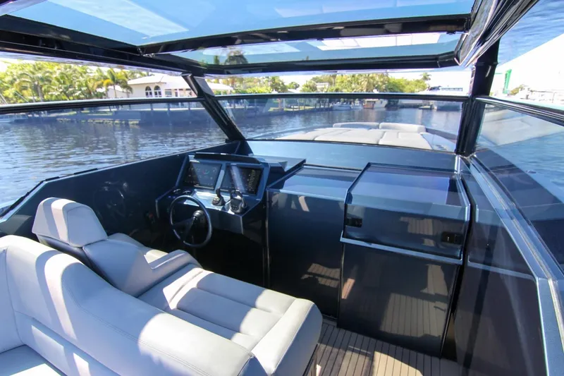 Slide: The Image of Interior view of 2022 Vanquish Yachts VQ45 with modern helm and seating. - 41