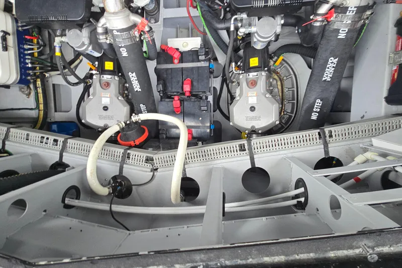 Slide: The Image of Engine compartment of a 2022 Vanquish VQ45, showcasing mechanical components and hoses. - 14
