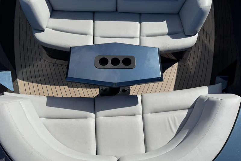 Slide: The Image of 2022 Vanquish VQ45 yacht interior with sleek seating and modern table design. - 15
