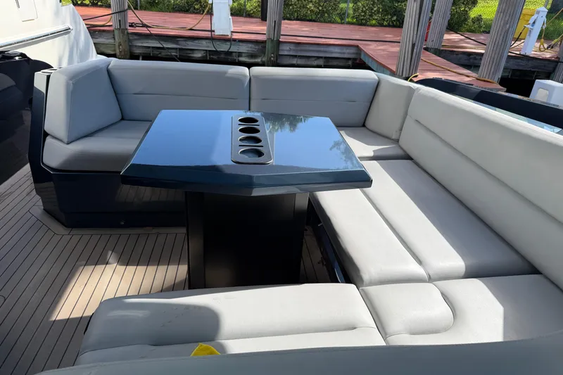 Slide: The Image of Luxurious seating area on 2022 Vanquish VQ45 yacht with sleek table design. - 19