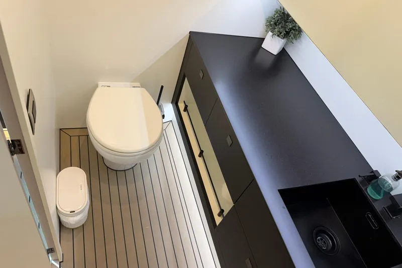 Slide: The Image of Modern bathroom in 2022 Vanquish VQ45 yacht with sleek fixtures and minimalist design. - 26