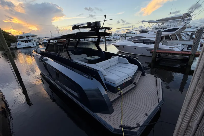 Slide: The Image of 2022 Vanquish VQ45 luxury yacht docked at sunset, featuring sleek design and spacious seating. - 29
