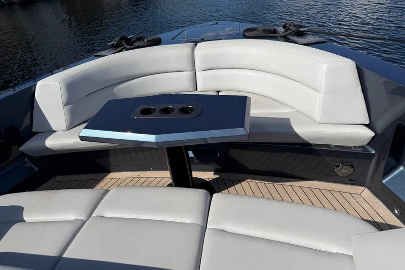 Slide: The Image of Luxurious seating area on 2022 Vanquish VQ45 yacht with sleek table design. - 8