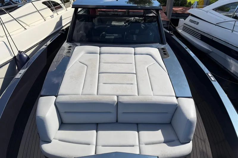 Slide: The Image of 2022 Vanquish VQ45 luxury yacht with sleek design and spacious seating area. - 9