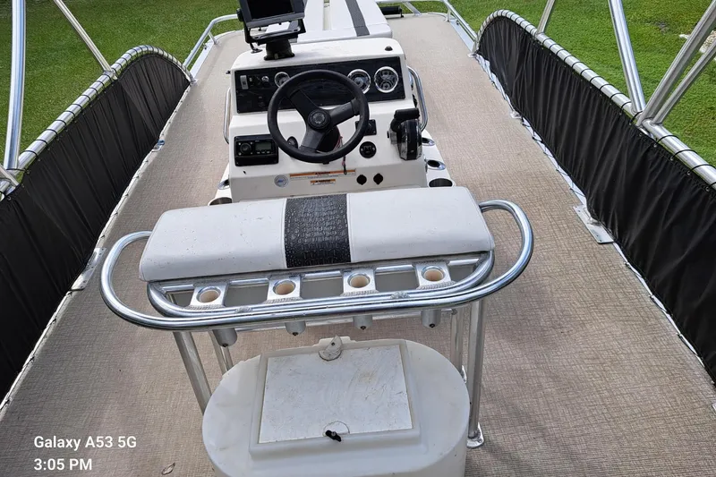 Slide: The Image of 2021 Avalon GS CC Fish boat interior with steering console and seating. - 6