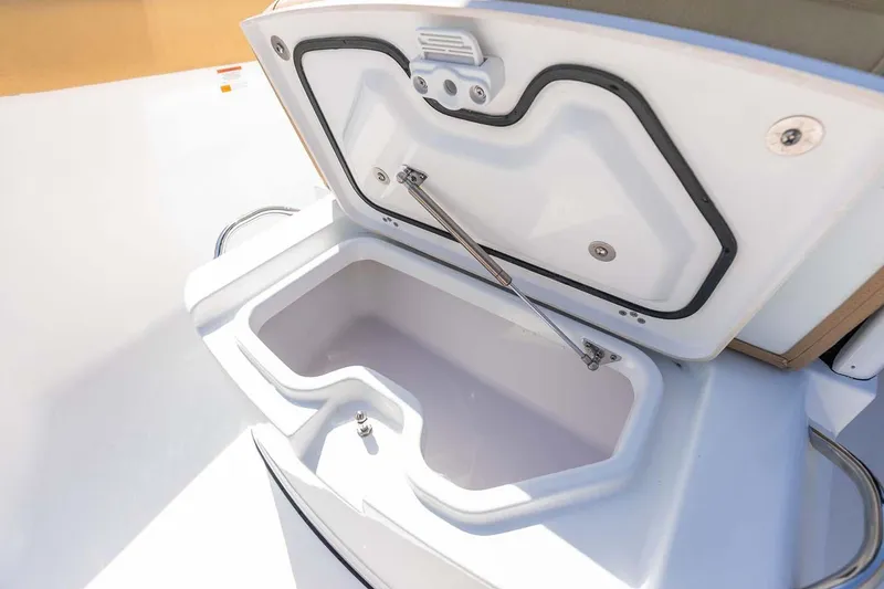 Slide: The Image of Manufacturer Provided Image: Open storage compartment on 2025 Sportsman Heritage 261 Center Console boat. - 14