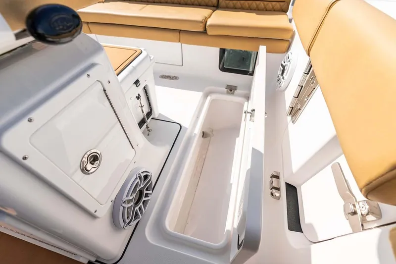 Slide: The Image of Manufacturer Provided Image: 2025 Sportsman Heritage 261 Center Console interior with storage compartment and seating. - 22