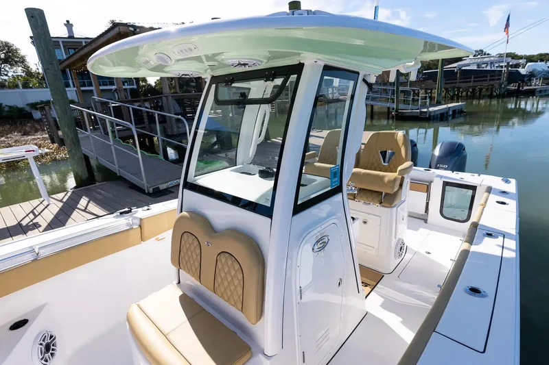Slide: The Image of Manufacturer Provided Image: 2025 Sportsman Open 262 Center Console boat on open water, featuring dual engines. - 12