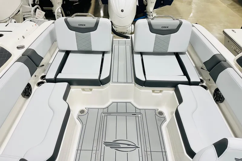 Slide: The Image of 2026 Chaparral 250 OSX boat interior with sleek seating and modern design. - 10