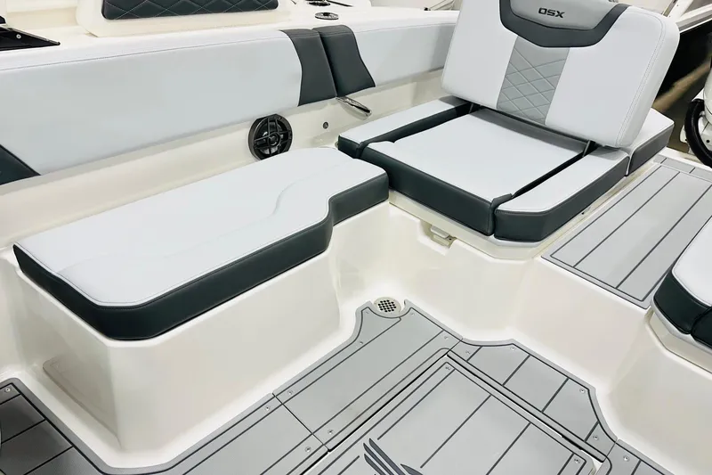 Slide: The Image of 2026 Chaparral 250 OSX boat interior with sleek seating and modern design. - 11