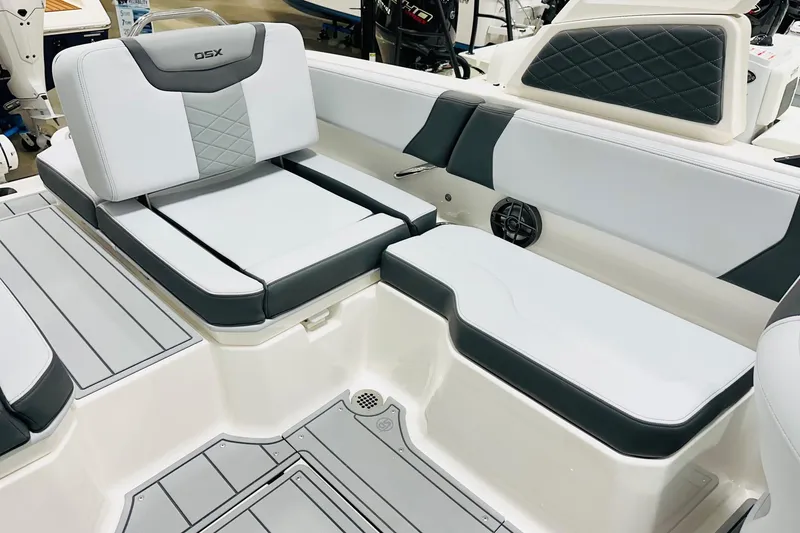 Slide: The Image of 2026 Chaparral 250 OSX boat interior with sleek, modern seating and stylish design. - 12