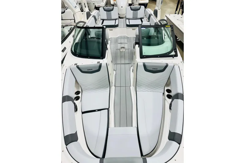 Slide: The Image of 2026 Chaparral 250 OSX boat interior with sleek seating and modern design. - 9