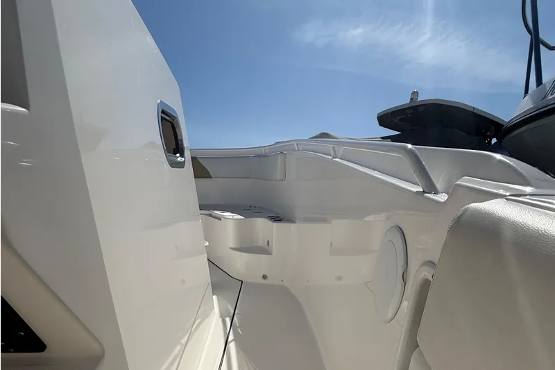 Slide: The Image of 2016 Edgewater 280CC boat interior under clear blue sky. - 15