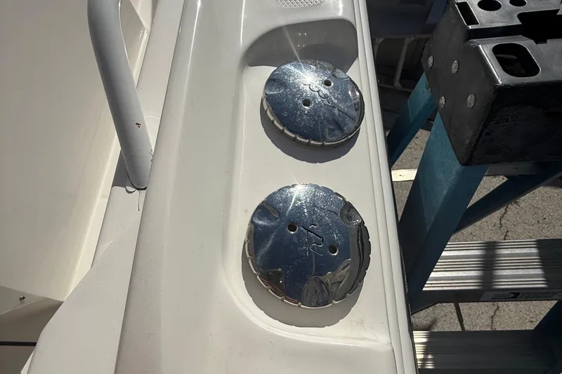 Slide: The Image of Edgewater 280CC 2016 boat deck with metal fixtures in sunlight. - 22