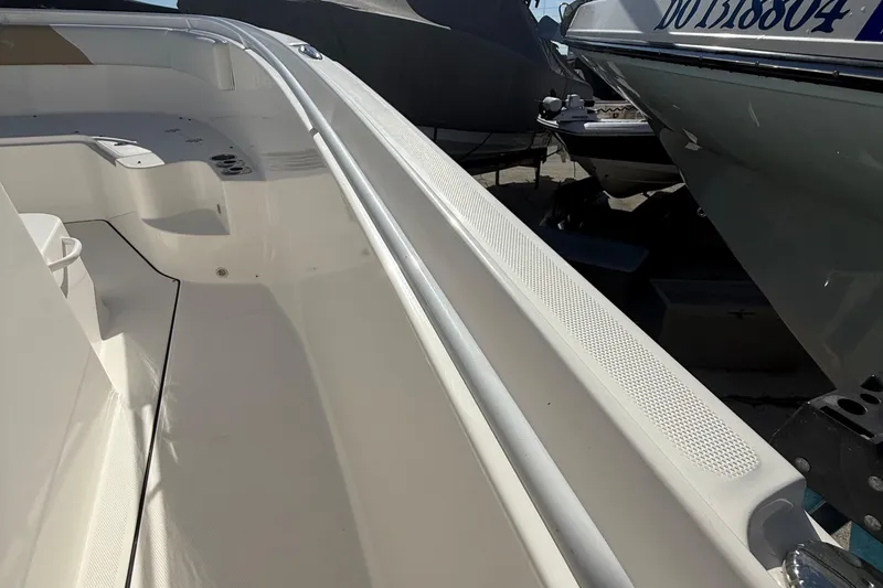 Slide: The Image of 2016 Edgewater 280CC boat interior, showcasing spacious seating and sleek design. - 28