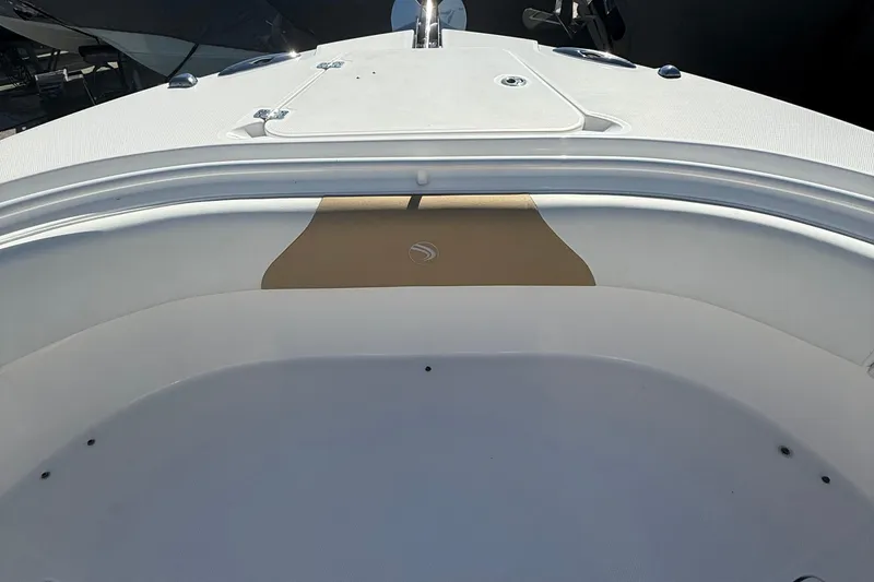 Slide: The Image of 2016 Edgewater 280CC boat interior, featuring a clean, spacious deck area. - 29