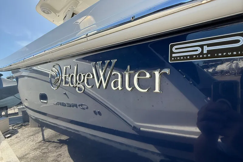 Slide: The Image of 2016 Edgewater 280CC boat with logo and Single Piece Infusion label. - 50