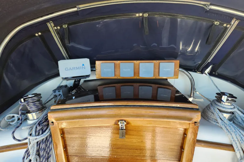 Slide: The Image of Cockpit of 1985 Mason 33 sailboat with Garmin navigation and ropes. - 10