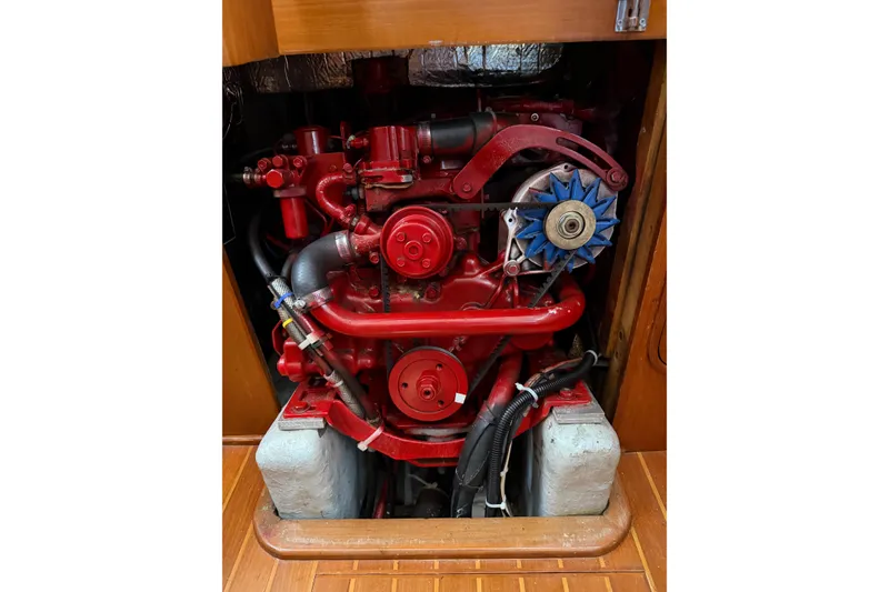 Slide: The Image of Red engine inside a Mason 33 boat, model year 1985, with visible components. - 24