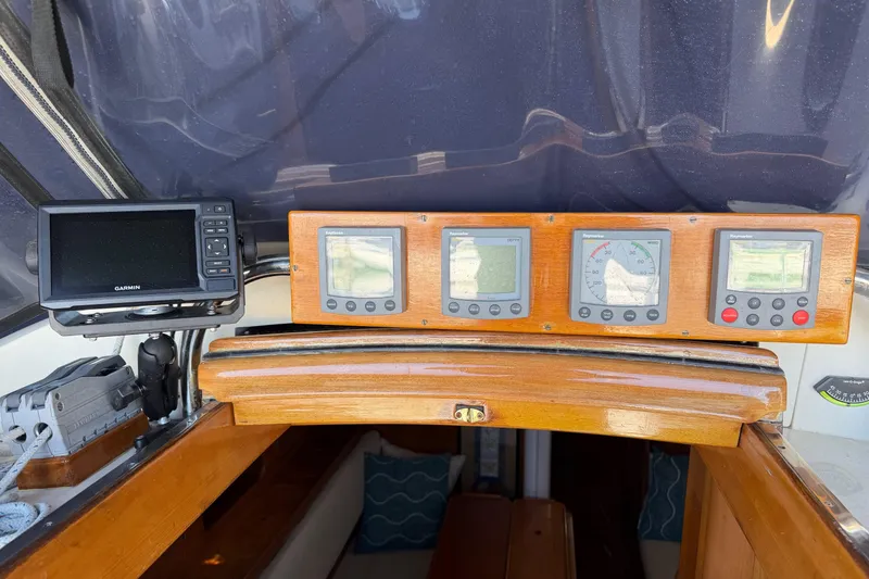 Slide: The Image of Control panel of a 1985 Mason 33 sailboat with navigation instruments and displays. - 26