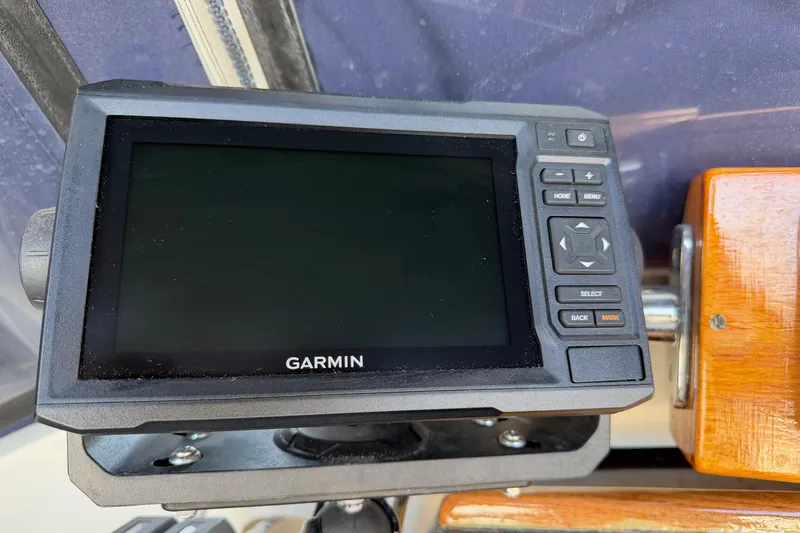 Slide: The Image of Garmin navigation device on a 1985 Mason 33 boat dashboard. - 27
