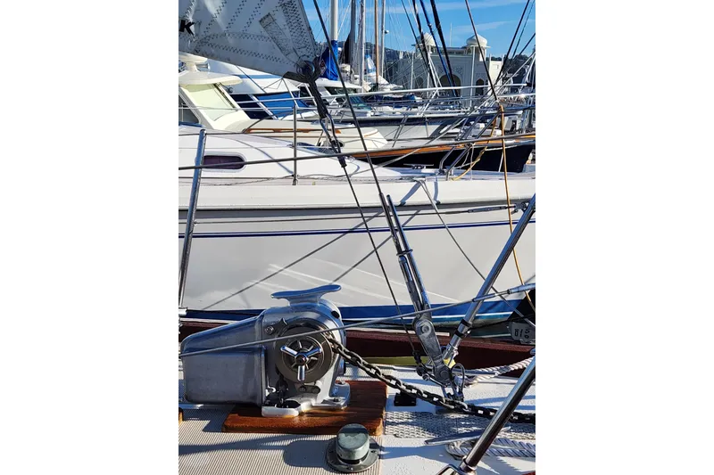 Slide: The Image of Sailboat deck with winch and rigging, Mason 33, 1985 model, docked in marina. - 9