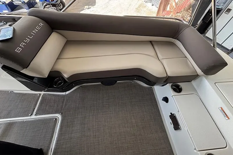 Slide: The Image of 2017 Bayliner Element XR7 boat interior with cushioned seating and modern design. - 12