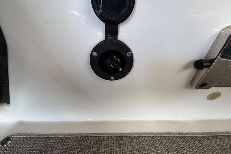 Slide: The Image of 2017 Bayliner Element XR7 boat power outlet and control panel. - 14