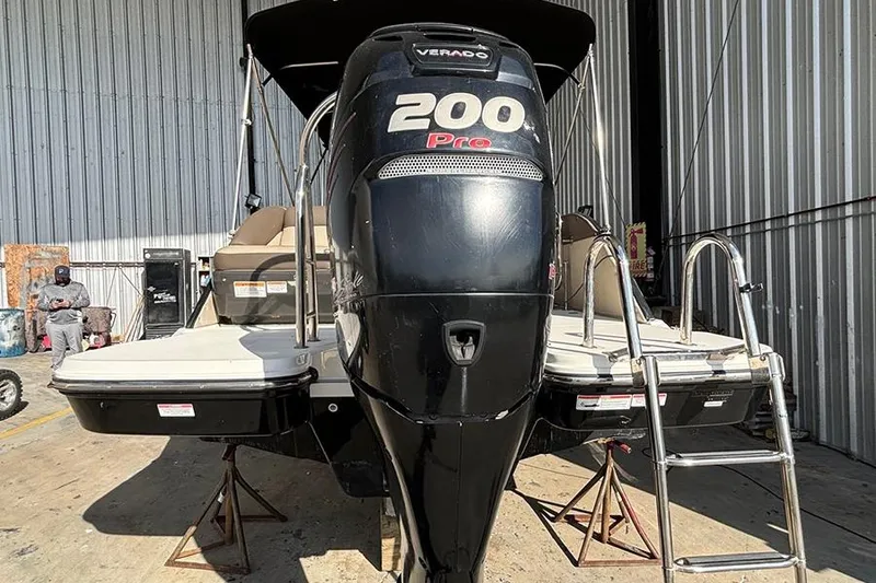 Slide: The Image of 2017 Bayliner Element XR7 with 200 Pro Verado engine in a storage facility. - 3