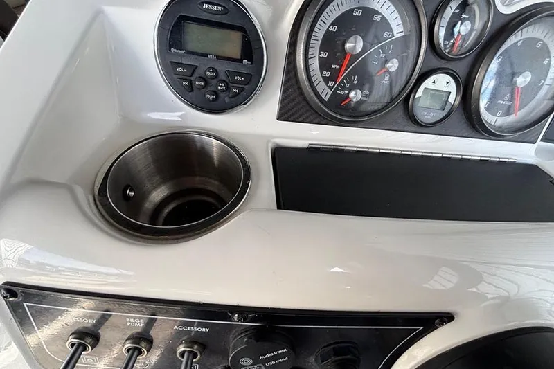 Slide: The Image of 2017 Bayliner Element XR7 dashboard with gauges, controls, and cup holder. - 8